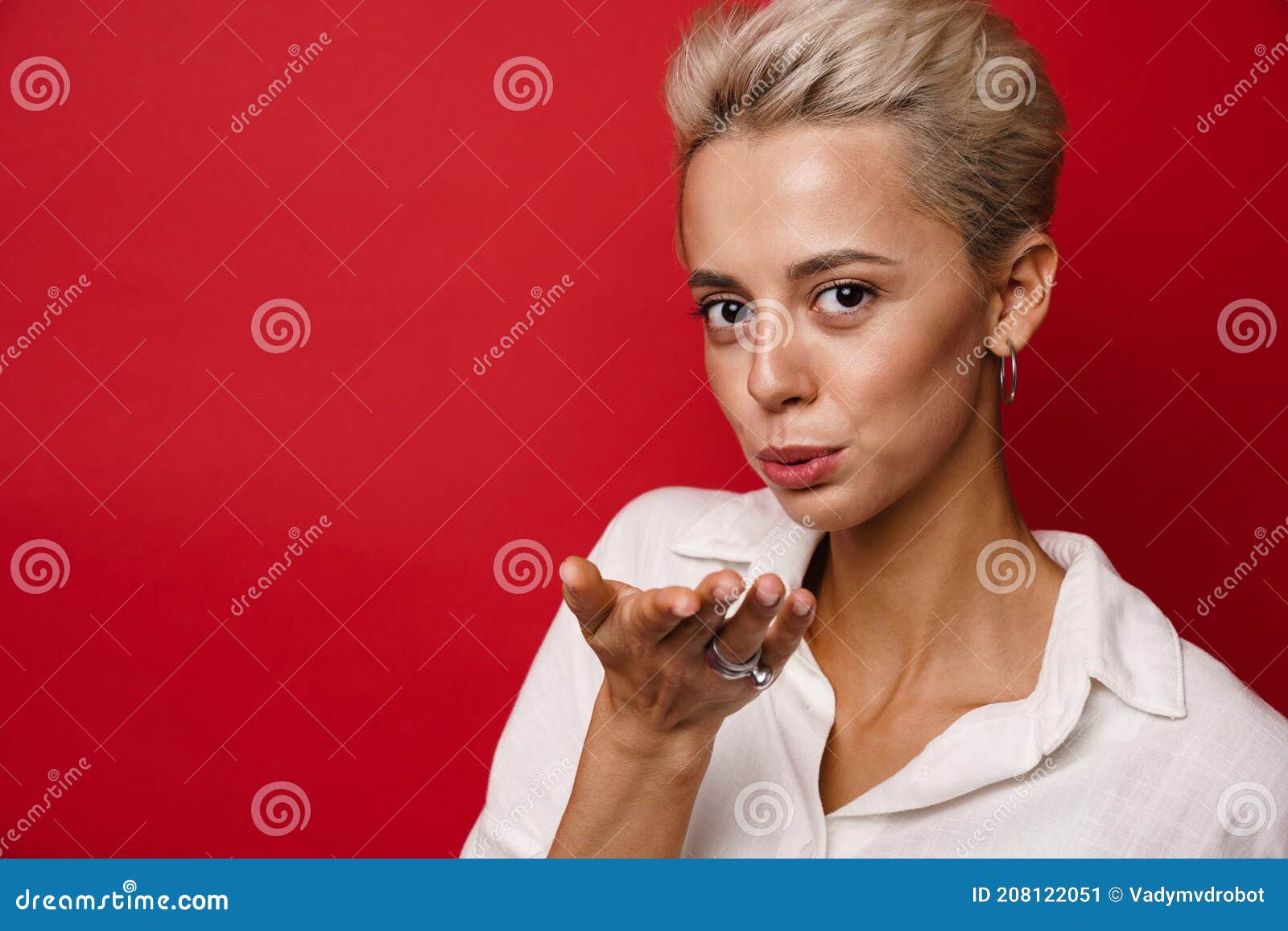 Happy Beautiful Blonde Girl Blowing Air Kiss At Camera Stock Image