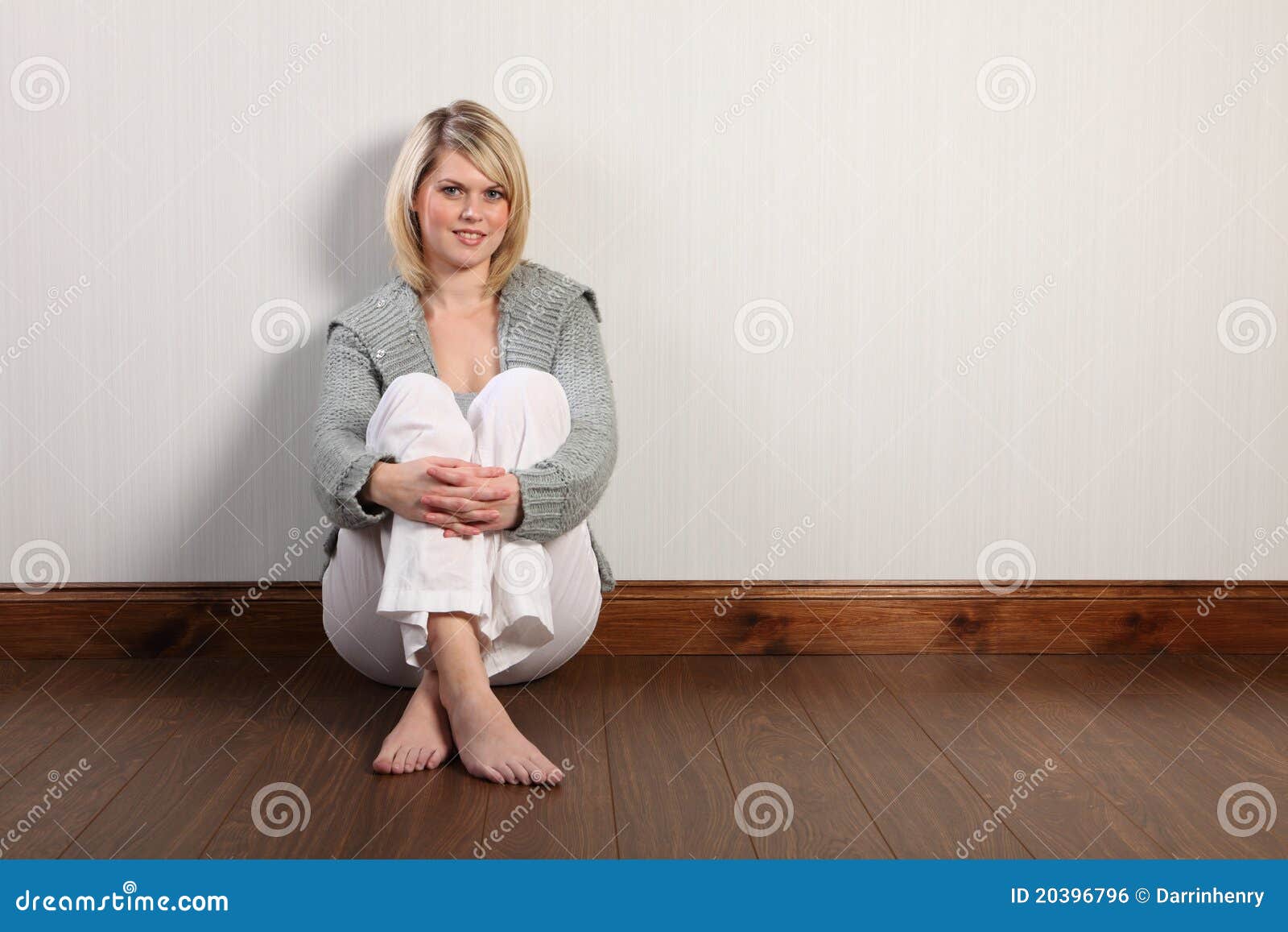 happy beautiful blonde woman in knitted cardigan