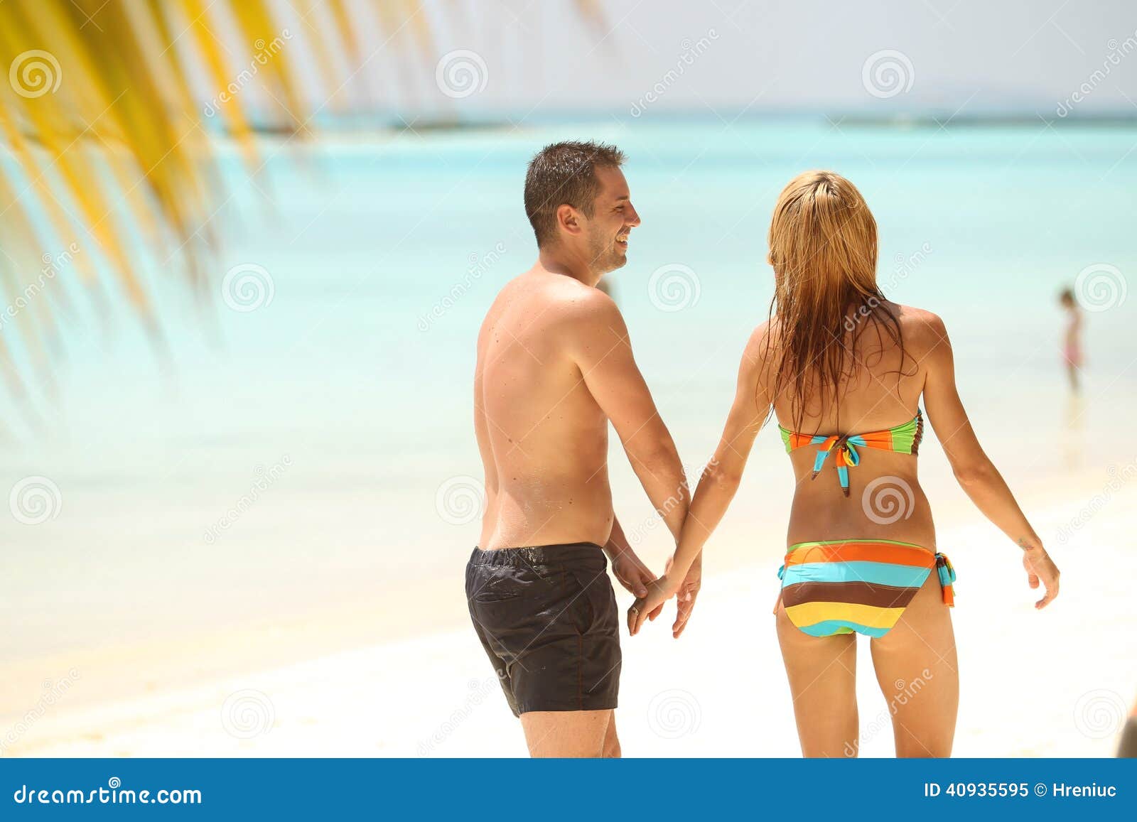 Happy Beautiful Couple Enjoying At Beach In Maldives Sunny