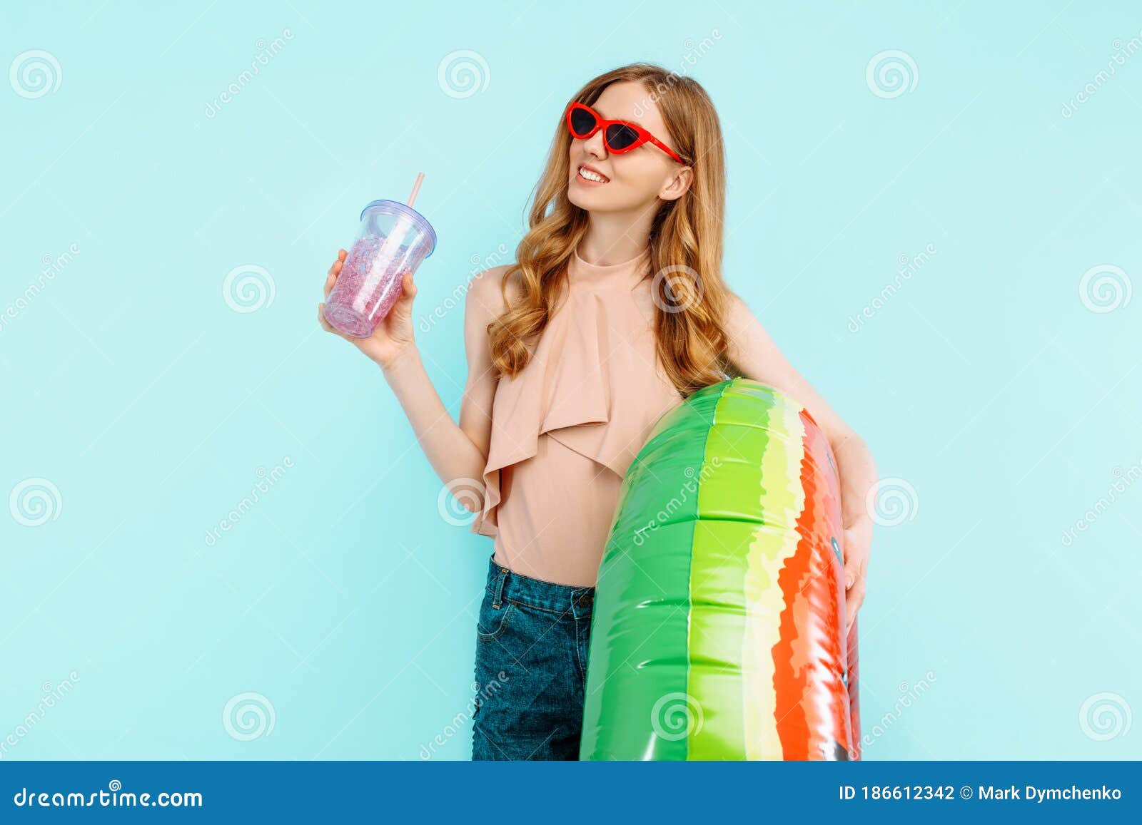 Happy Girl Dressed in a Swimsuit and Sunglasses Holds a Cocktail and an ...
