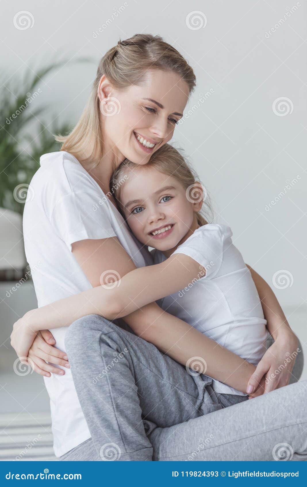 Happy Beautiful Mother And Daughter Embracing And Looking Stock Image Image Of Mommy Girl 