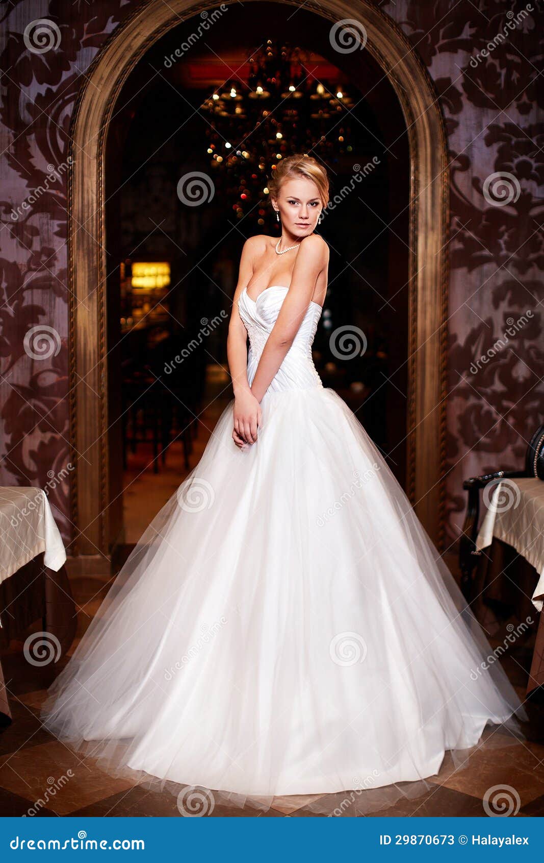 Beautiful woman with makeup and bridal hairstyle wearing white dress Stock  Photo - Alamy