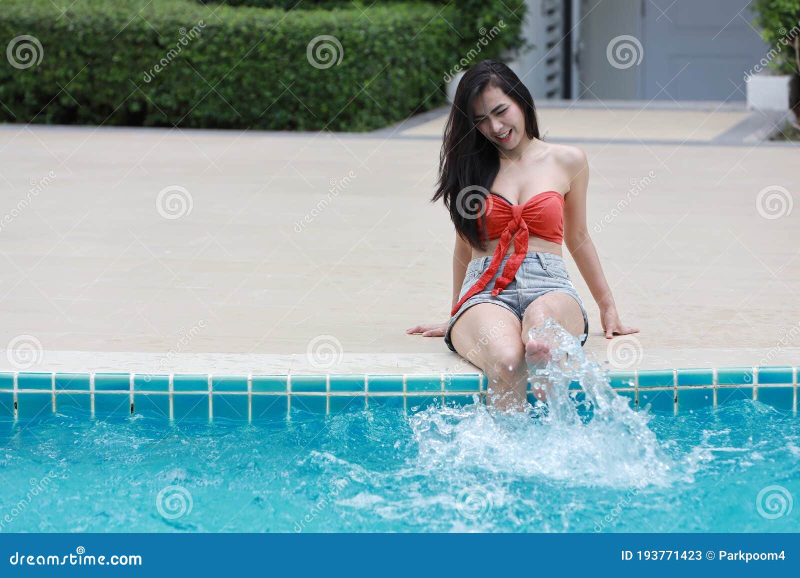Happy Beautiful And Woman In Orange Bikini Learn To Swim In Hotel Pool