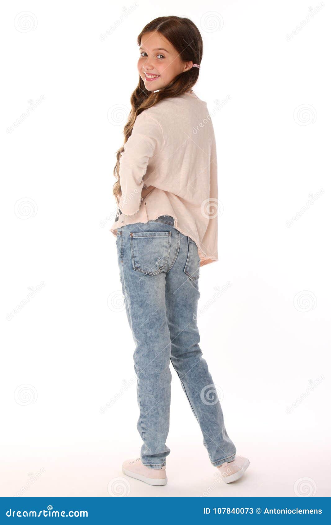 Happy Beautiful Smiling Slender Child Girl in Blue Jeans Stock Image ...