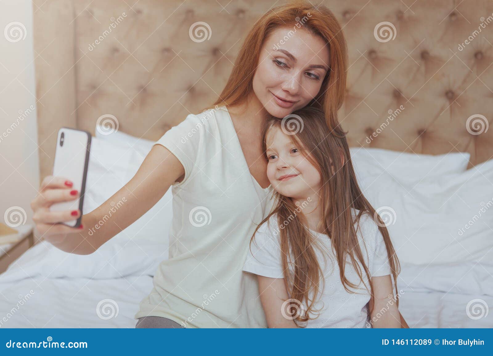 Beautiful Woman and Her Little Daughter Using Smart Phone Stock Image ...