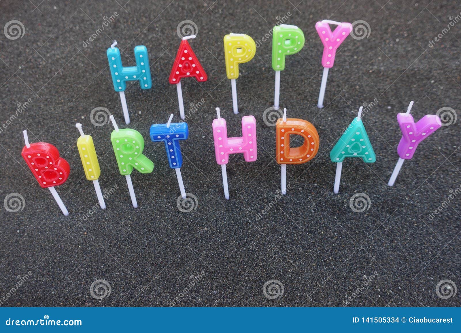 Happy Birthday Text with Candle Letters Over Black Sand Stock Photo ...