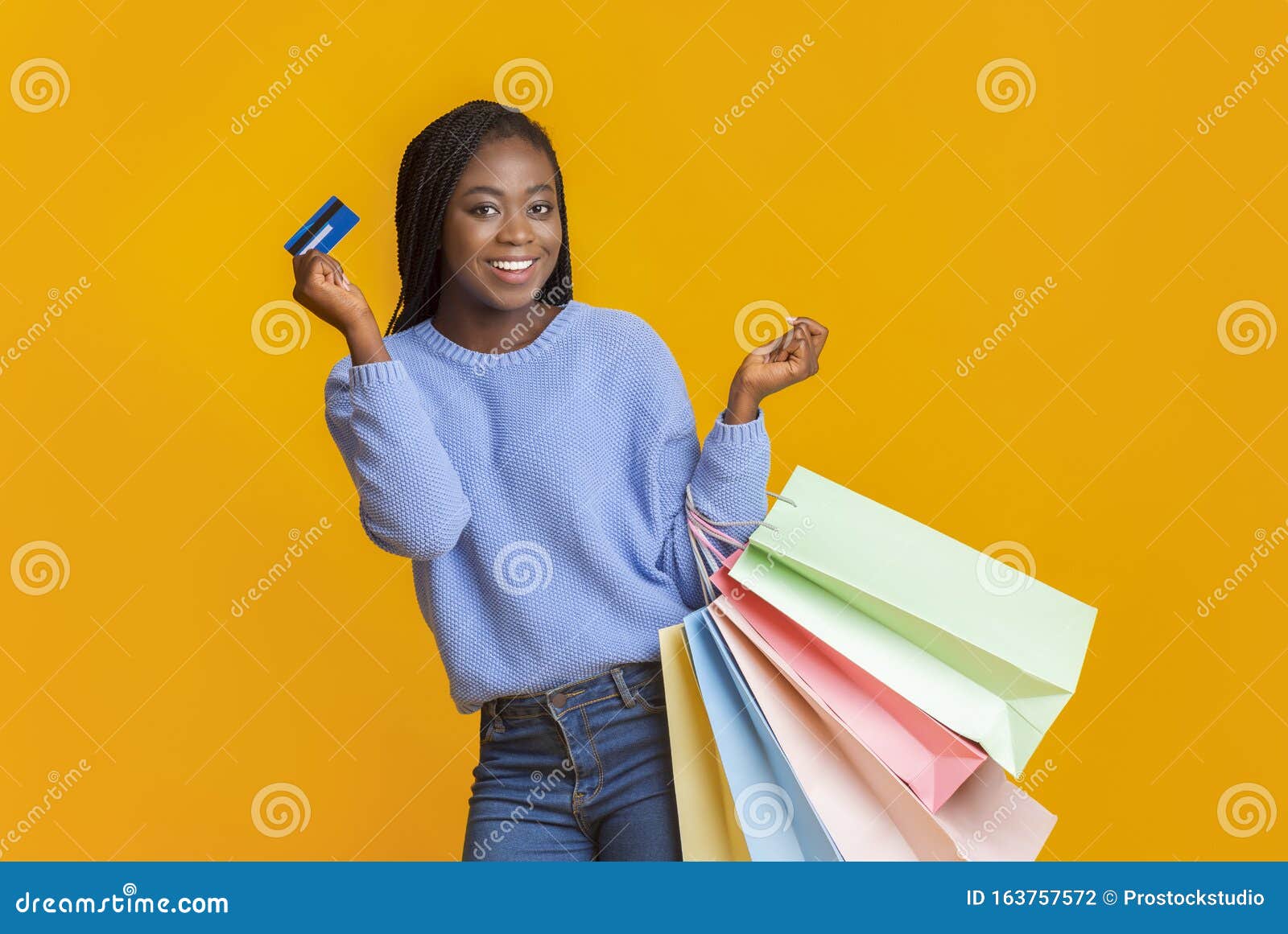 Happy Black Girl Recommending Credit Card, Holding Shopping Bags Stock ...
