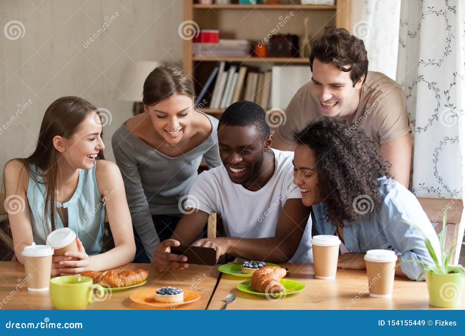 Happy Black Guy Showing Funny Videos on Smartphone. Stock Image - Image of  colleagues, gather: 154155449