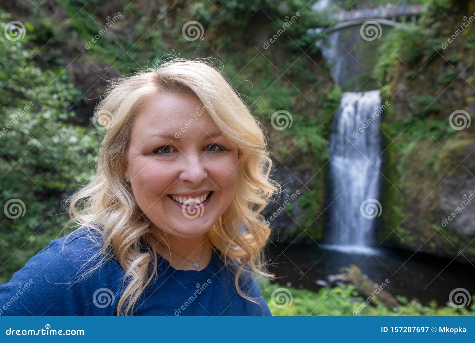 Happy Blond Woman 30 35 Years Old Poses At Multnomah Falls In Oregon Stock Image Image Of
