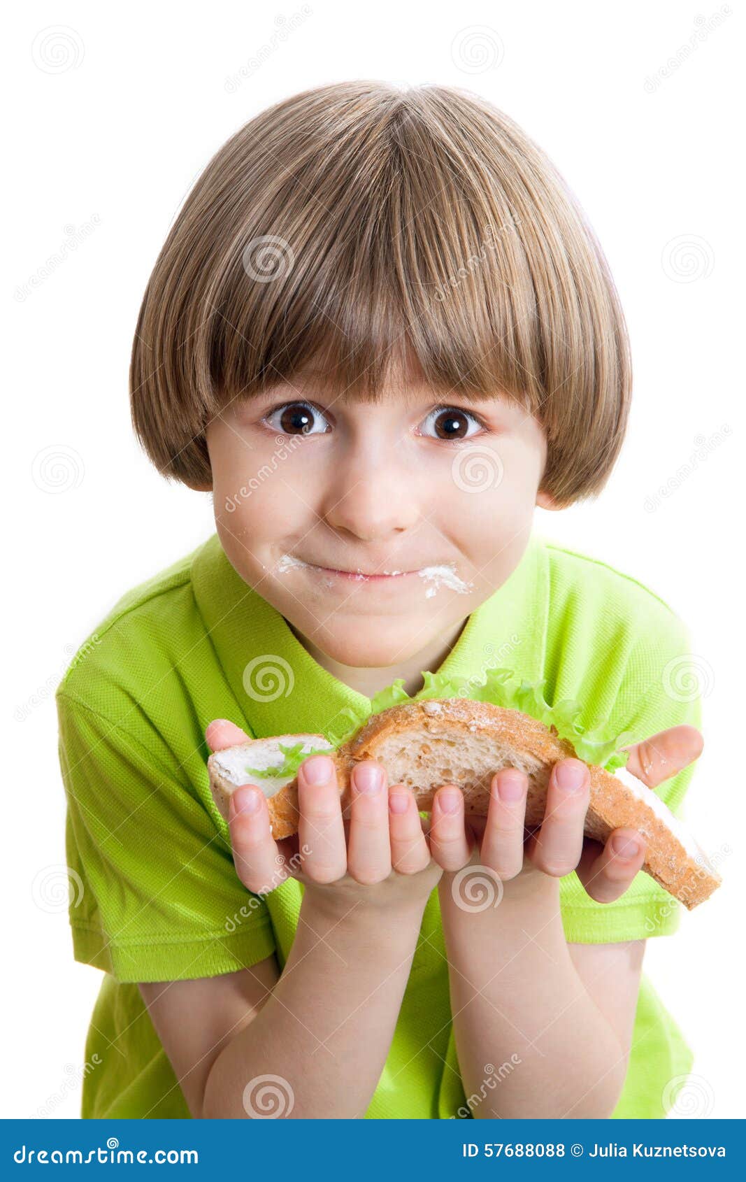 Happy boy holds a sandwich stock photo. Image of dinner 57688088