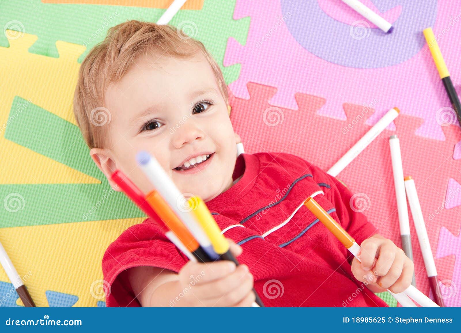happy boy with kids drawing pens