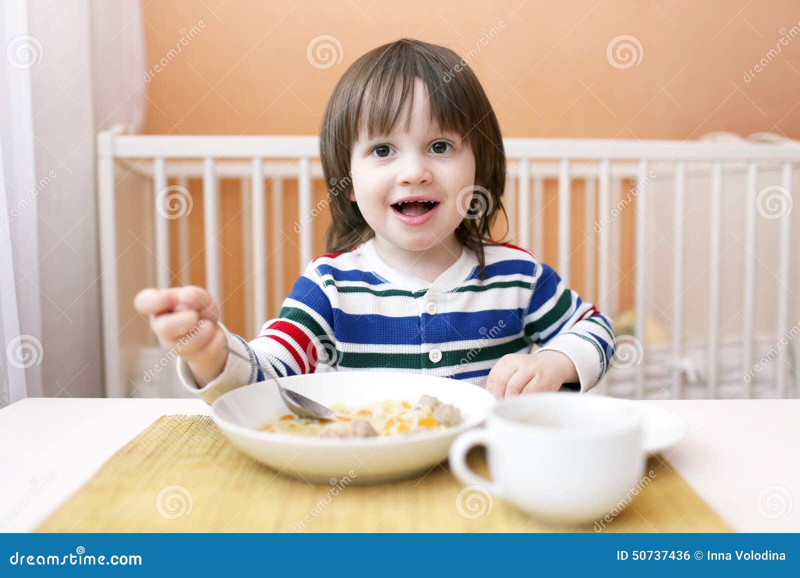 Happy boy with soup stock photo. Image of yearling 50737436