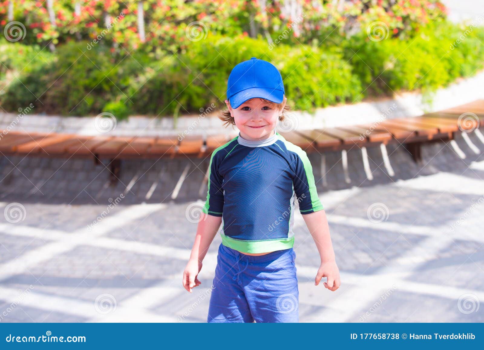 Happy Boy with Sun Protection. Cap and Sunscreen Clothes for a Hot