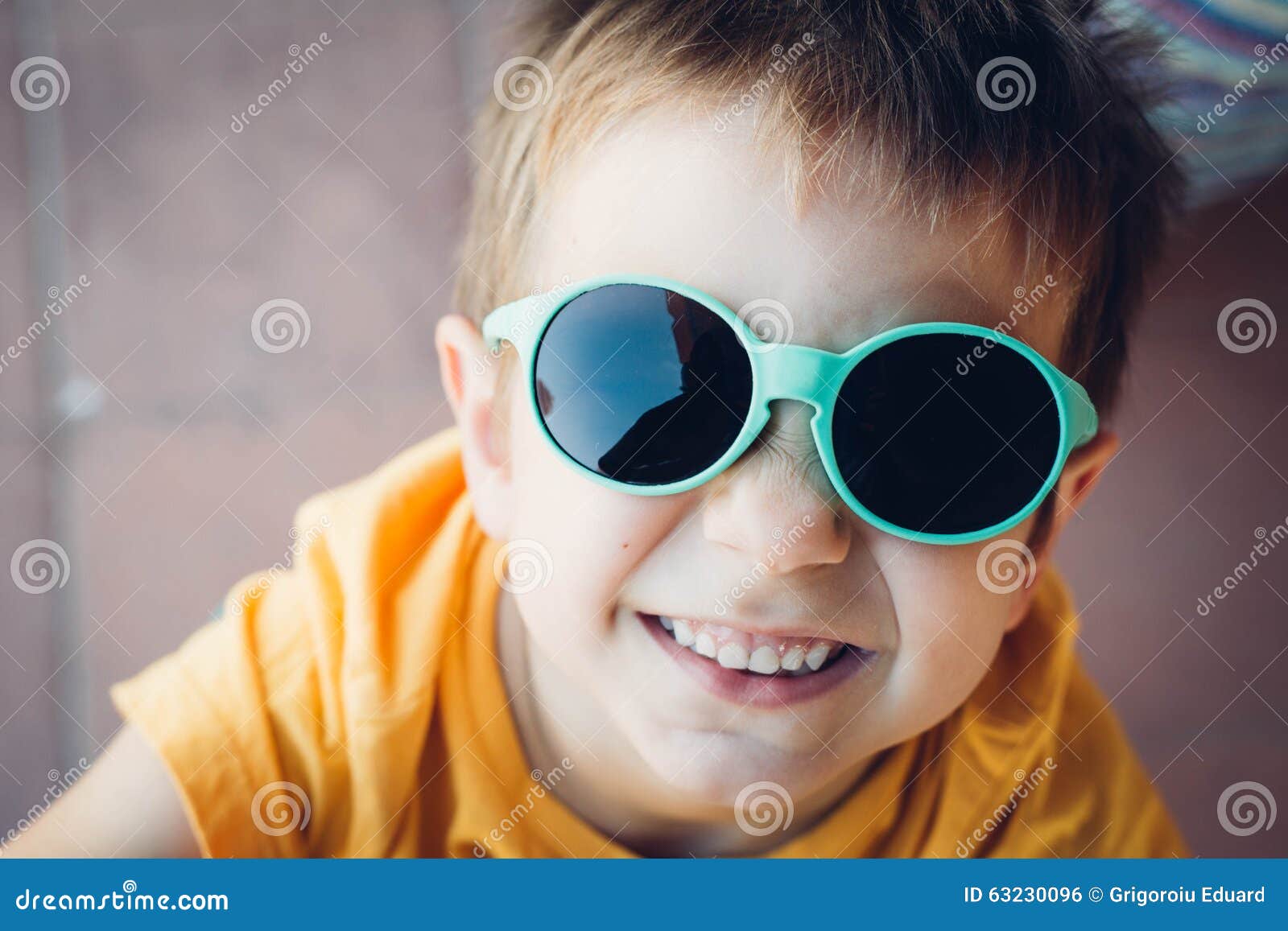 Happy boy with sunglasses stock photo. Image of children 63230096