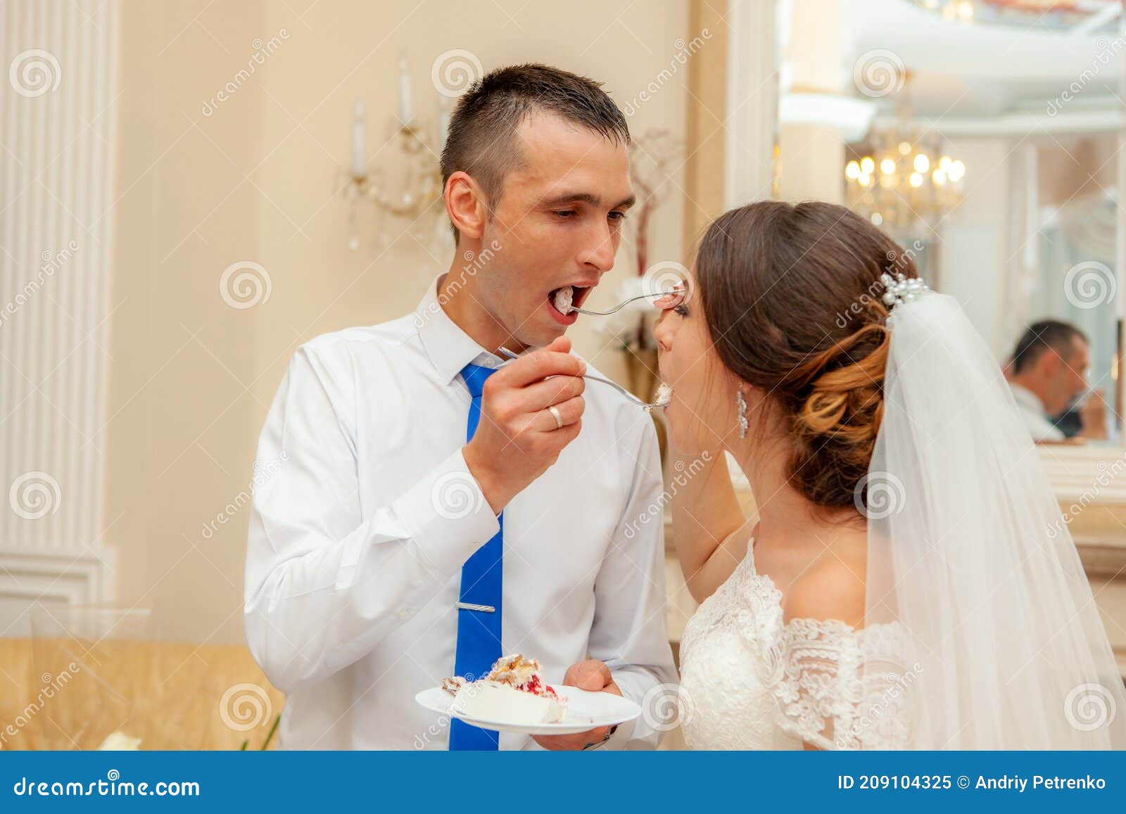 Bride and Groom Eat Wedding Cake Stock Image Image of fashion
