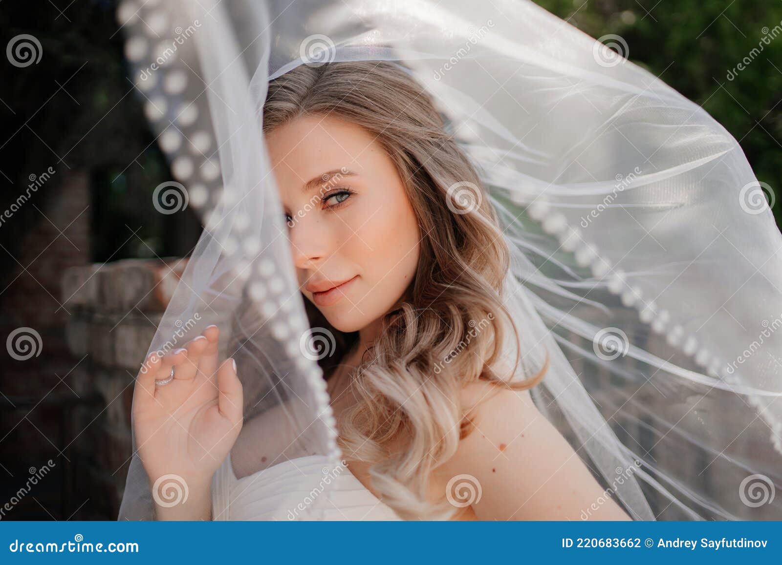 Happy Bride with Long Wavy Hair Under the Veil Outside. Wedding Make-up  Stock Photo - Image of long, glamour: 220683662
