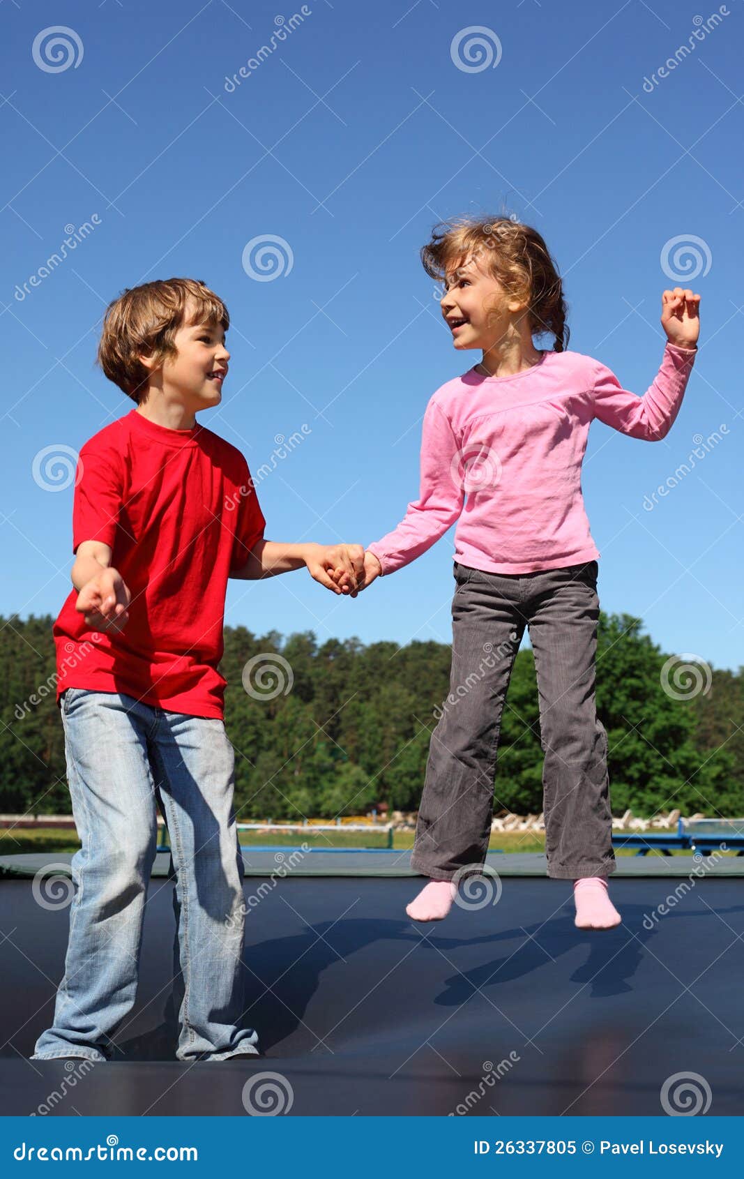 Happy Brother With Little Brother Lying In A Bed Together, Kissing And