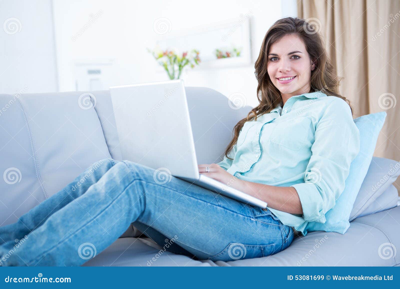 Happy Brunette Using Her Laptop on Couch Stock Image - Image of ...