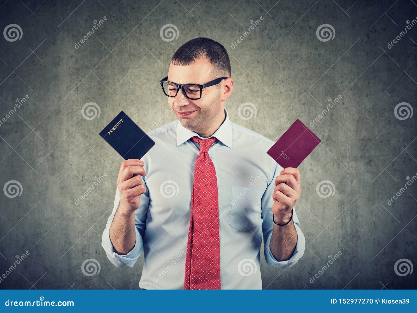happy business man with two passports, dual citizenship