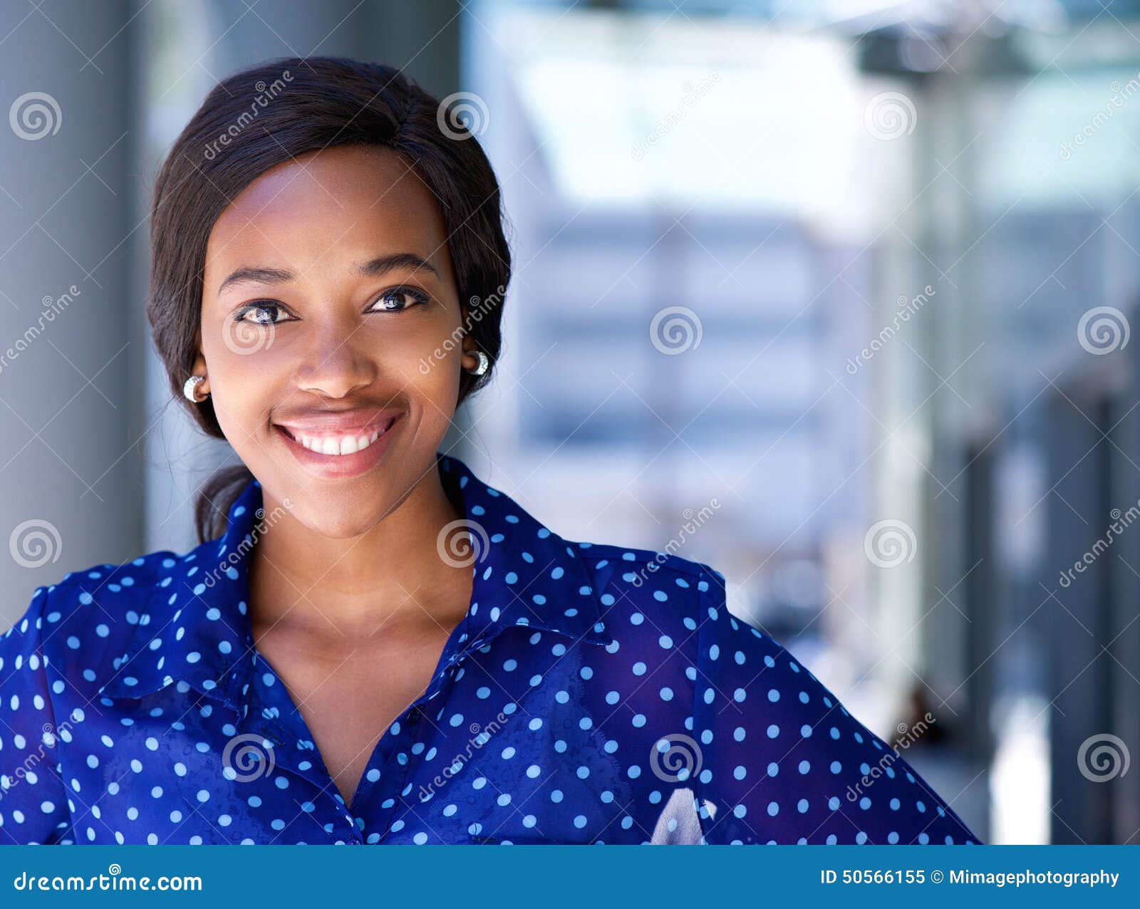 happy business woman smiling outside office building