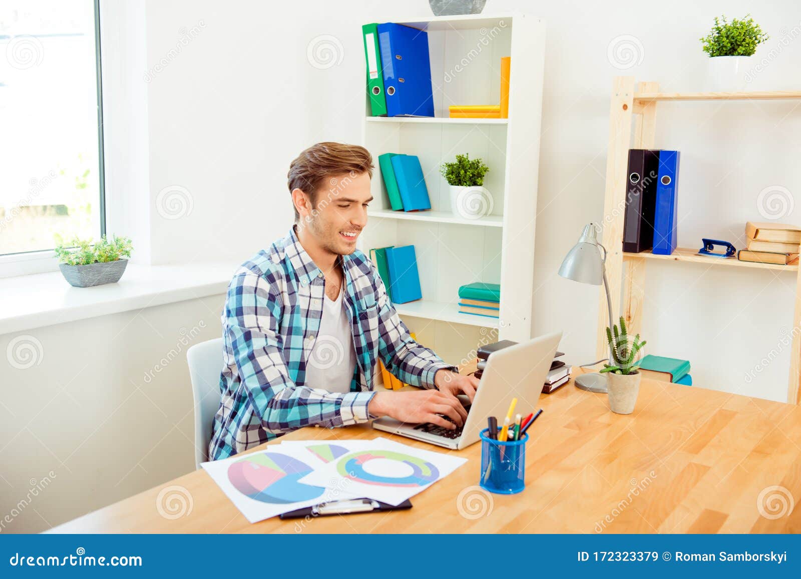 happy businessman preparing presentation and working with diagrama and laptop