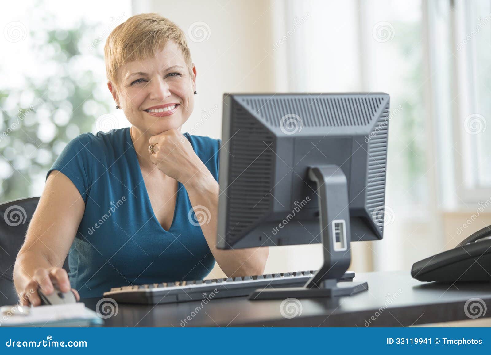 Happy Businesswoman Sitting At Computer Desk Stock Image ...