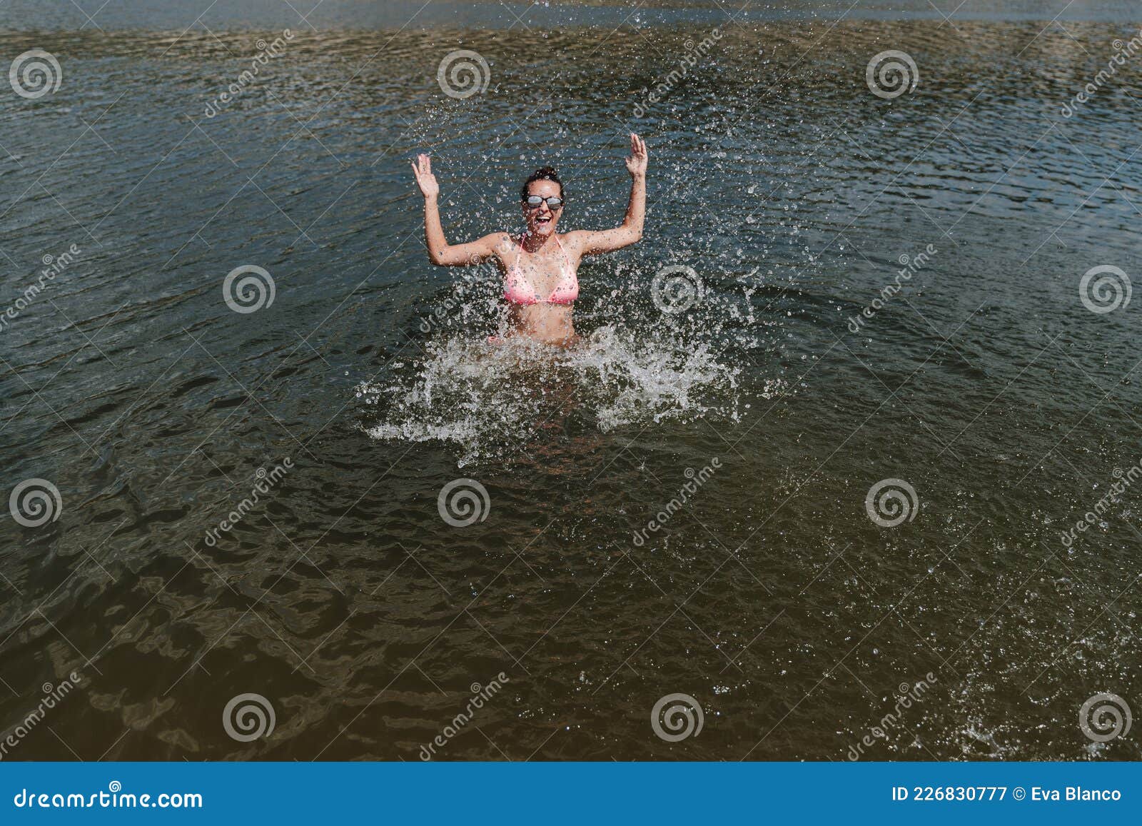 Happy Caucasian Woman Swimming In Lake And Splashing Summer Time Stock