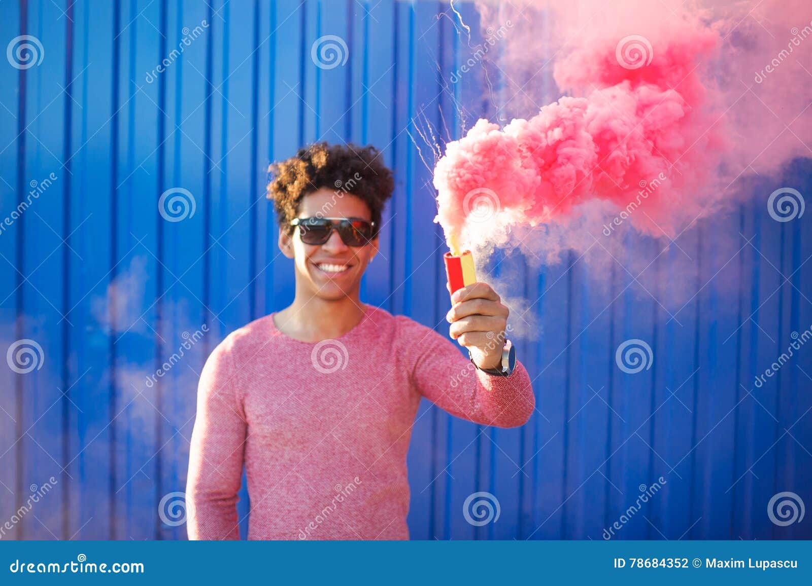 Happy Cheerful Man Holding a Smoke Grenade Stock Photo - Image of smile,  expression: 78684352