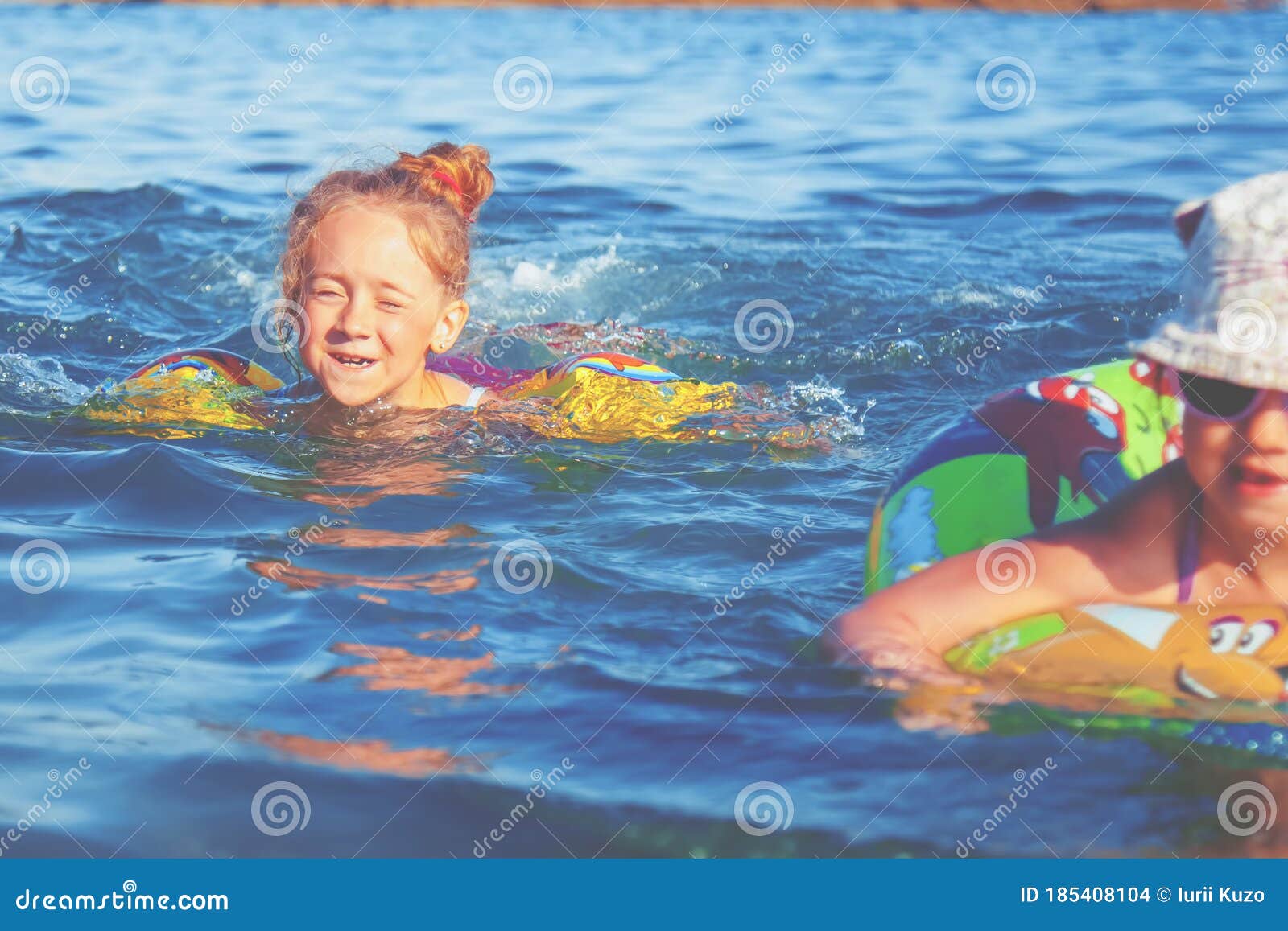 Happy Child Girls Swimming in the Sea. Kids Having Fun with Water Stock ...