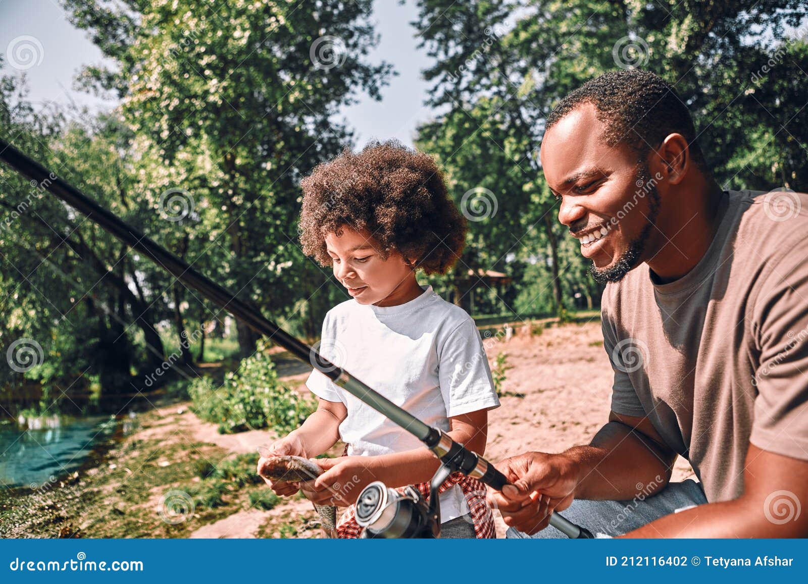 Happy Child and His Dad Fishing on Beautiful Day Outdoors Stock Photo -  Image of fish, hairstyle: 212116402