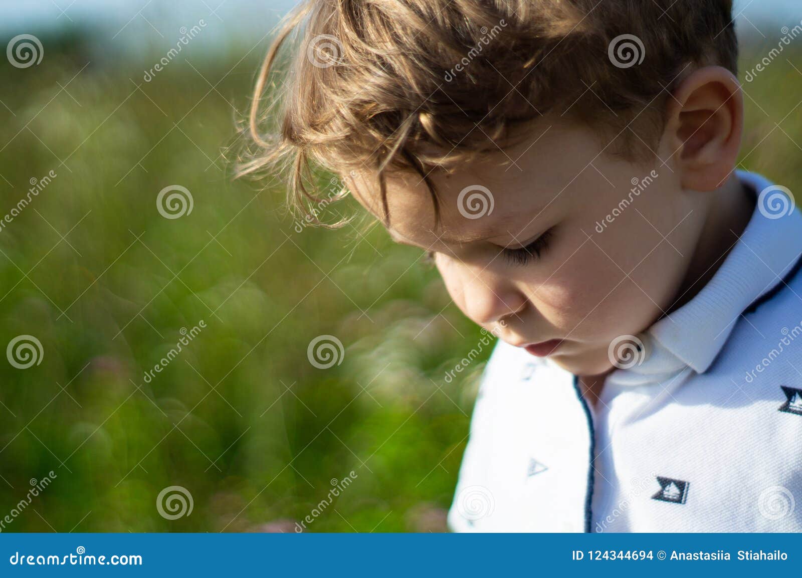 Happy Child, Little Boy Looks Down, Pensive Look in a White T-shirt ...