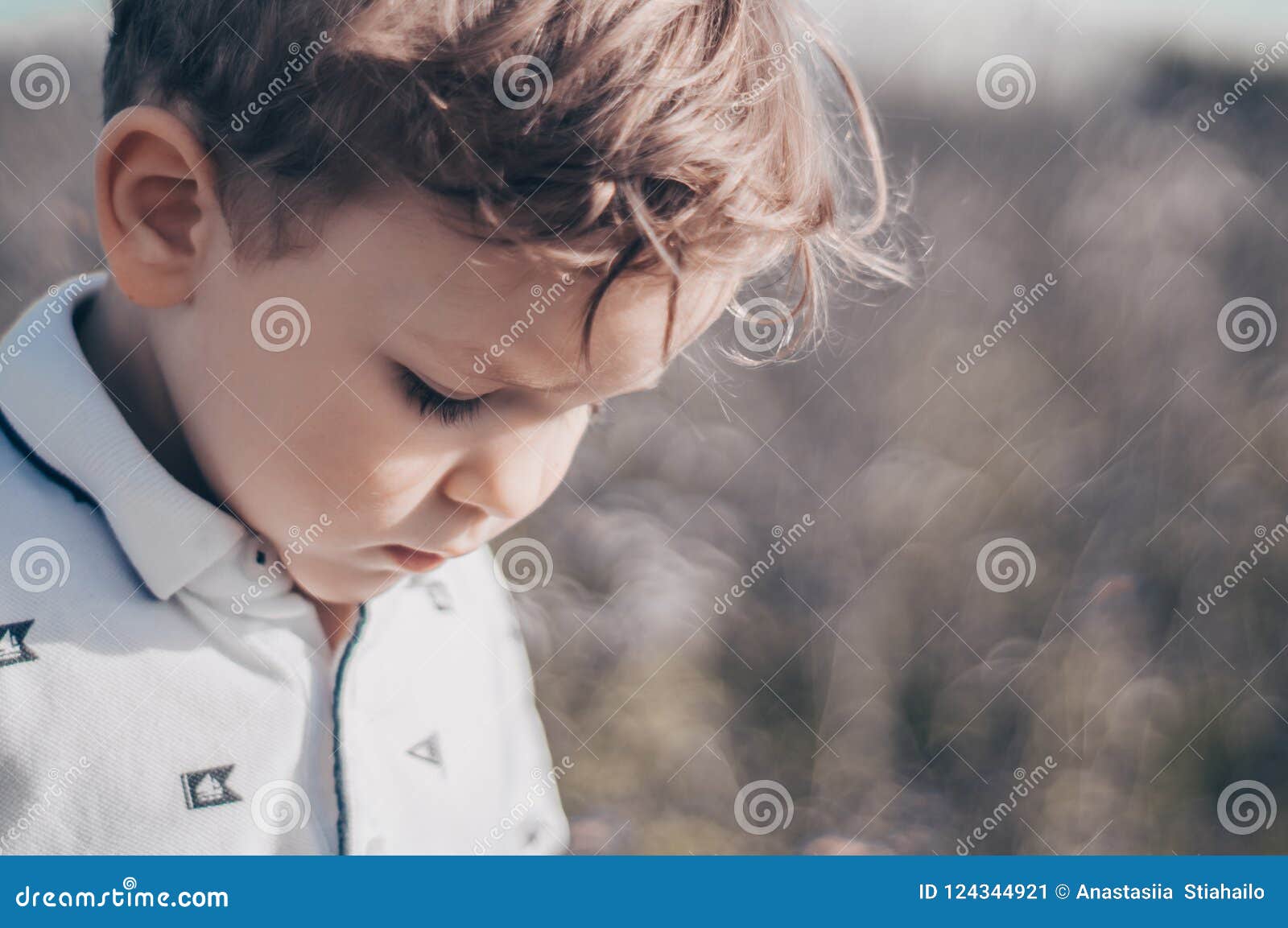 Happy Child, Little Boy Looks Down, Pensive Look in a White T-shirt ...