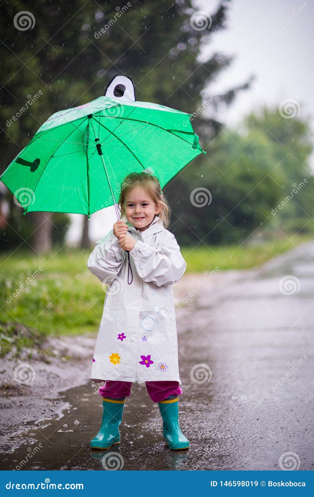 Raining day stock image. Image of child, happy, raincoat - 146598019