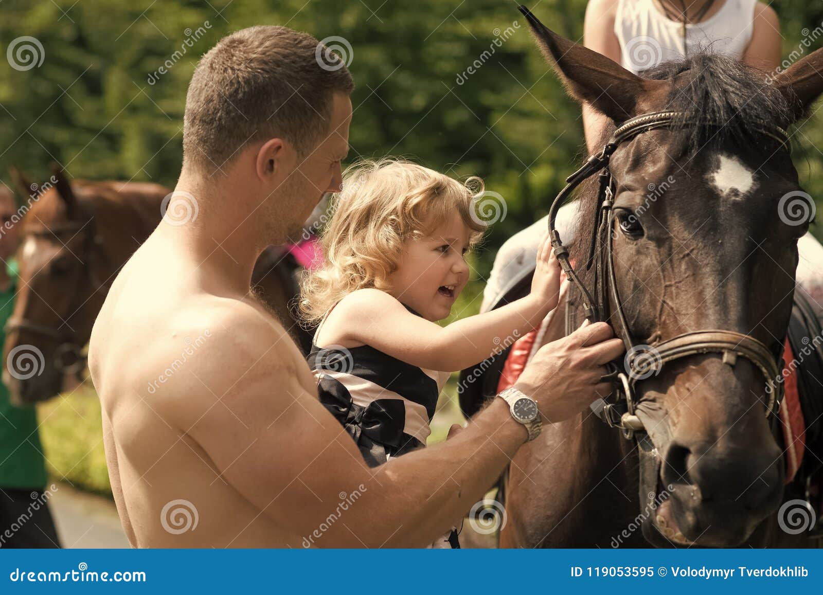 happy childhood, fathers day. child with muscular macho smile to animal