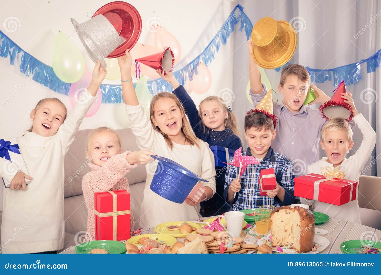 Happy Children Exchanging Gifts with Each Other during Party Stock ...