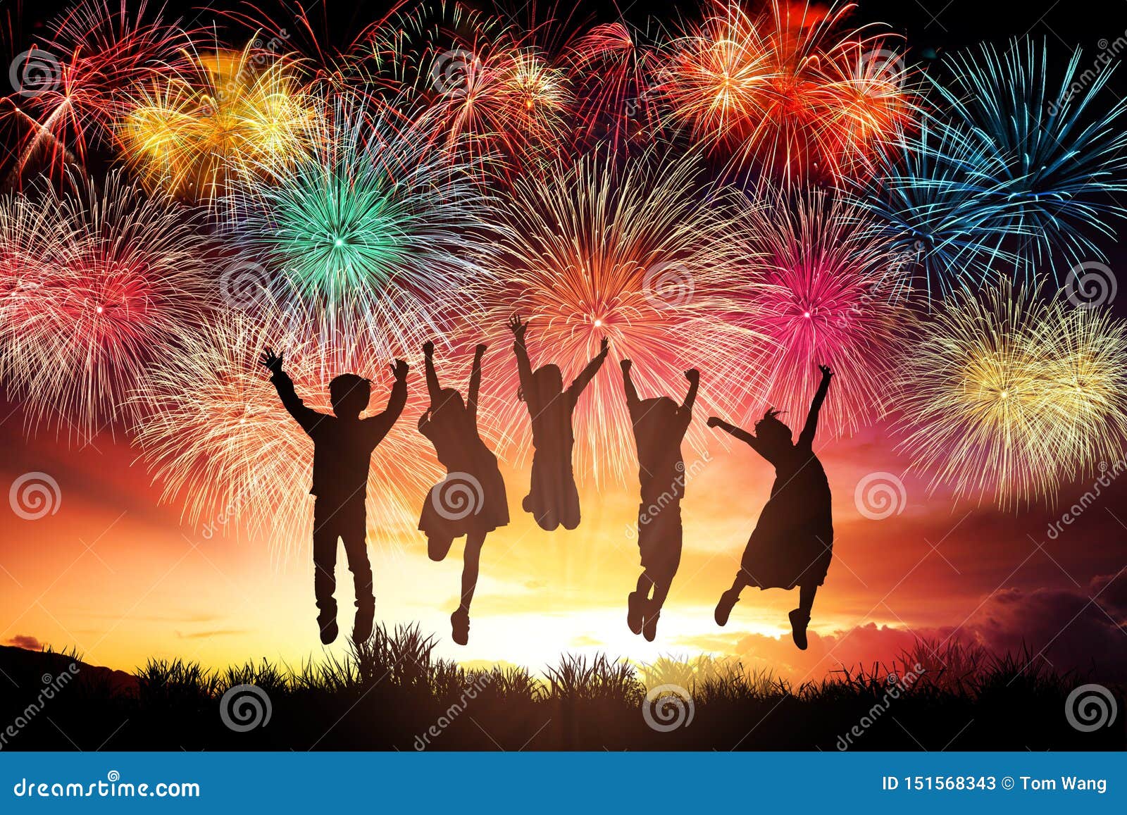 children jumping and watching the fireworks