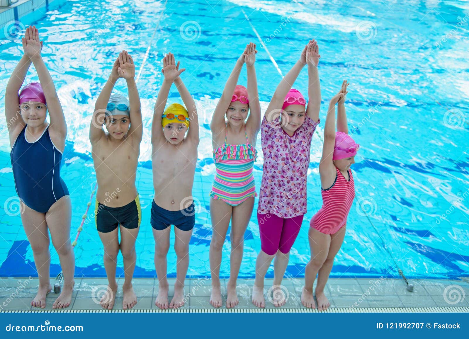 Happy Children Kids Group At Swimming Pool Class Learning To Swim Stock