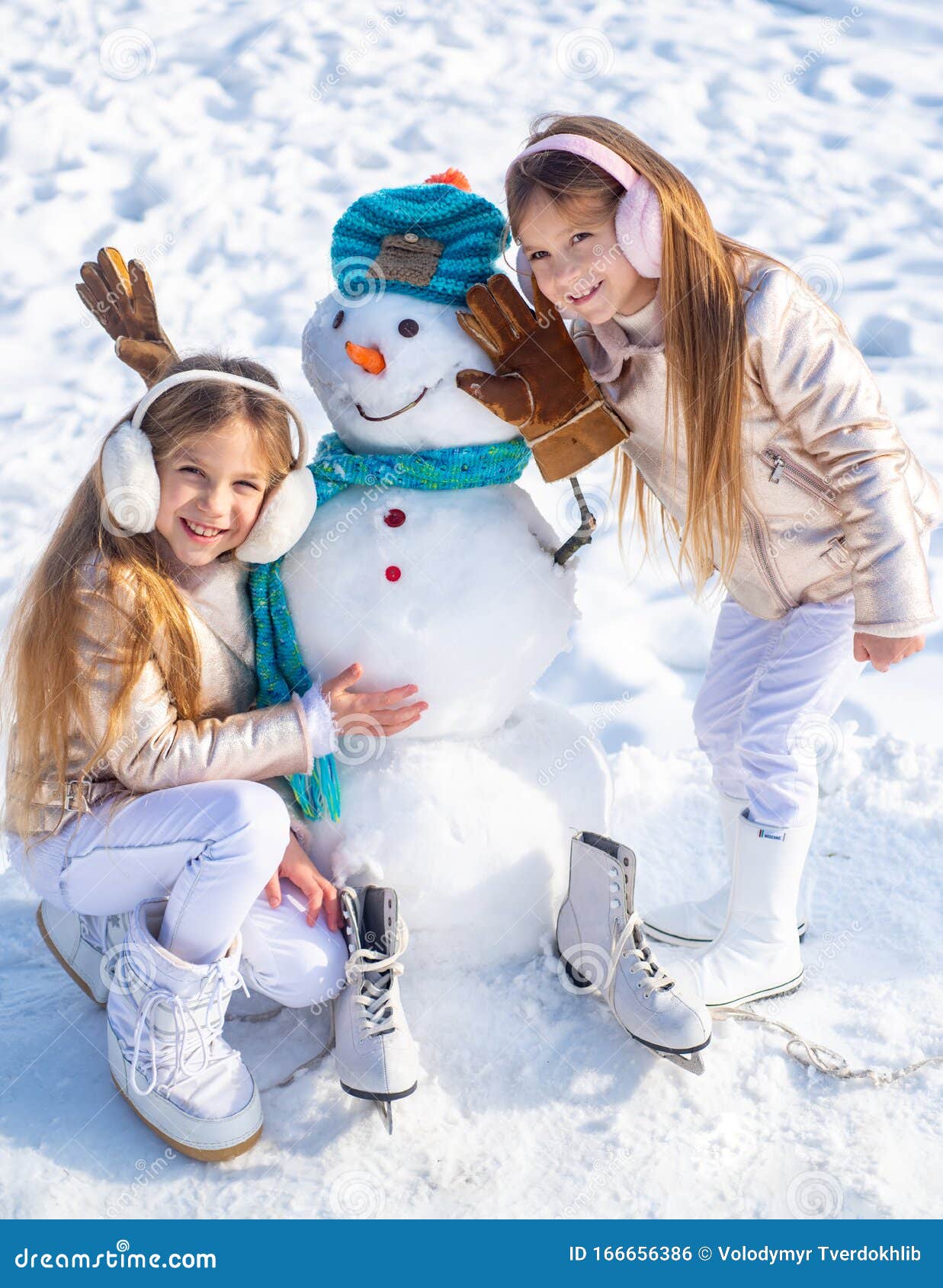 Happy Children Playing With A Snowman On A Snowy Winter ...