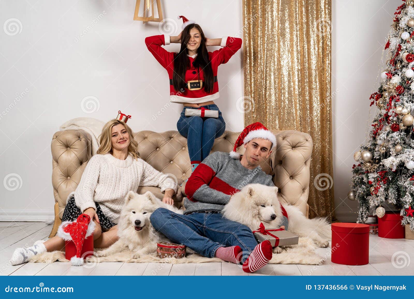 Happy Christmas Celebrating of Young People with Dogs and Gifts Stock ...