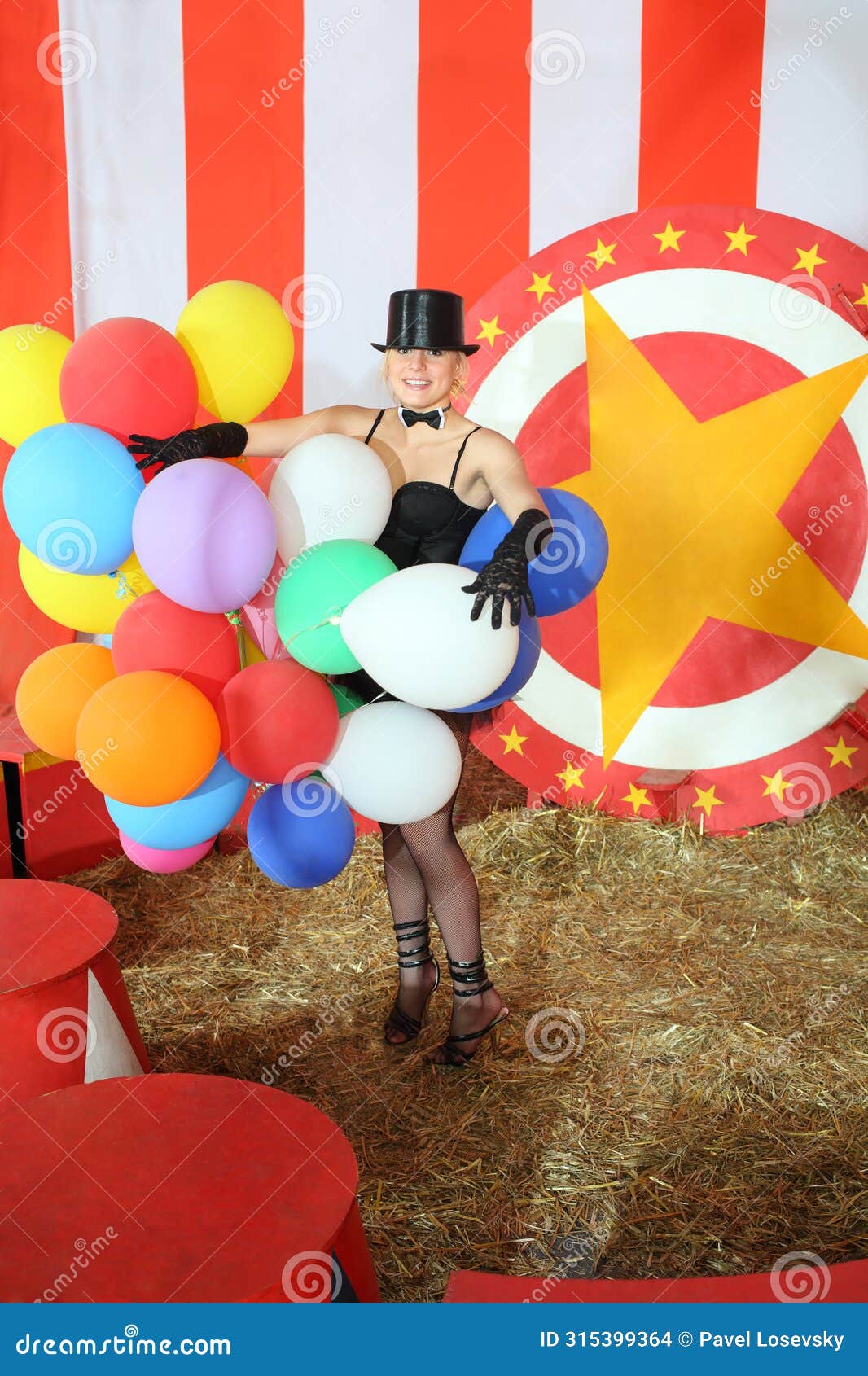 happy circus actress in black hat with colored