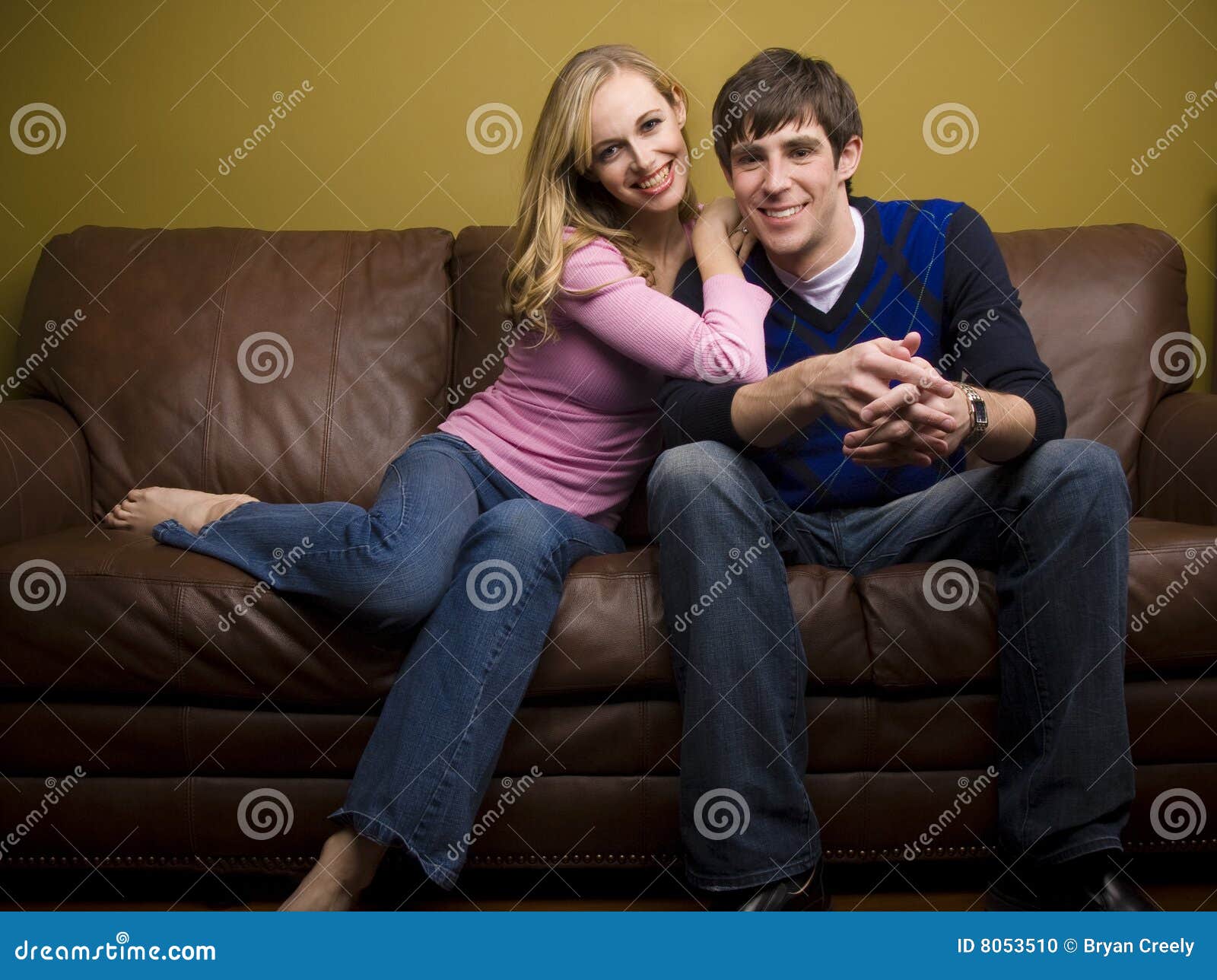 A Happy Couple Cuddles on the Couch Stock Photo Image of leaning