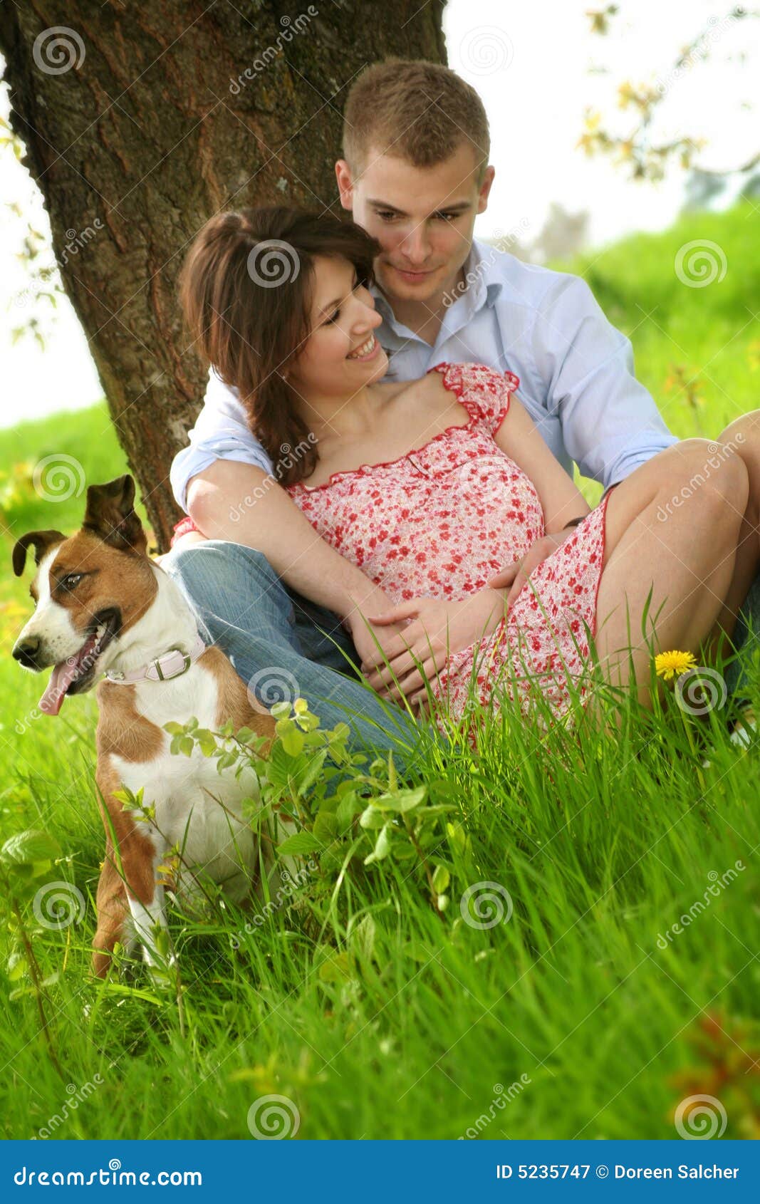 Happy couple with a dog stock image. Image of loving, laughing 5235747