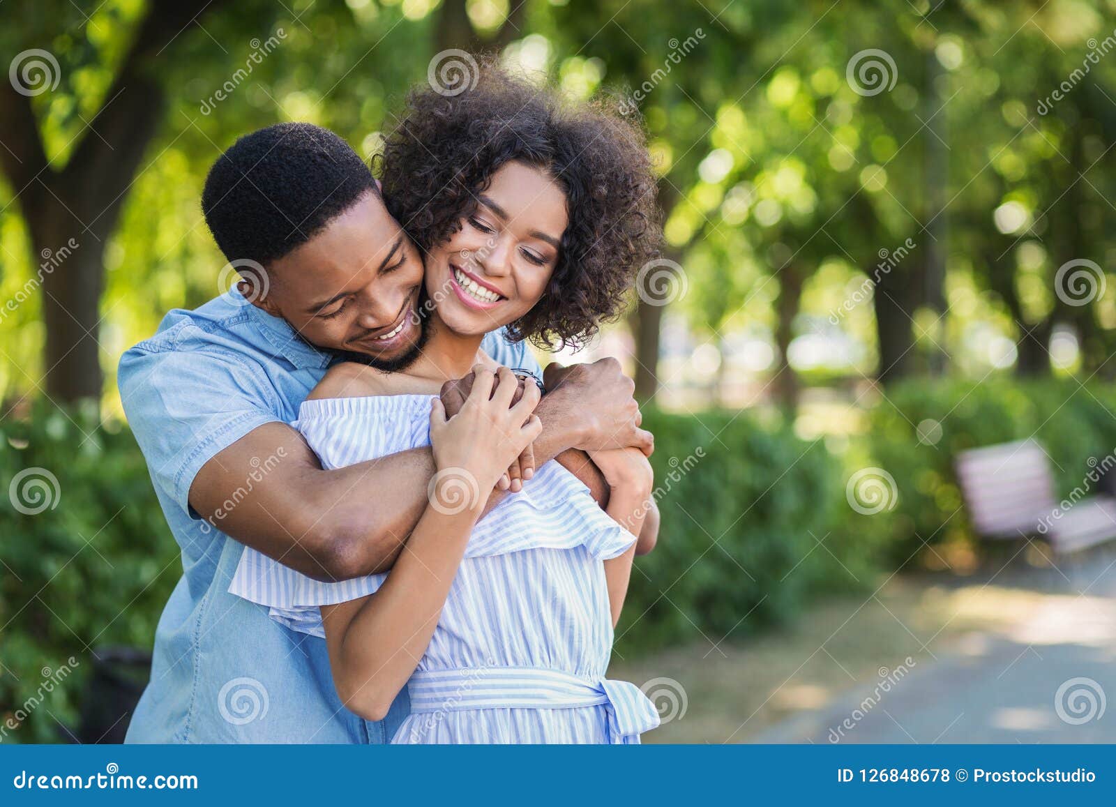 Happy Couple Embracing in Park on Sunny Day Stock Photo - Image of