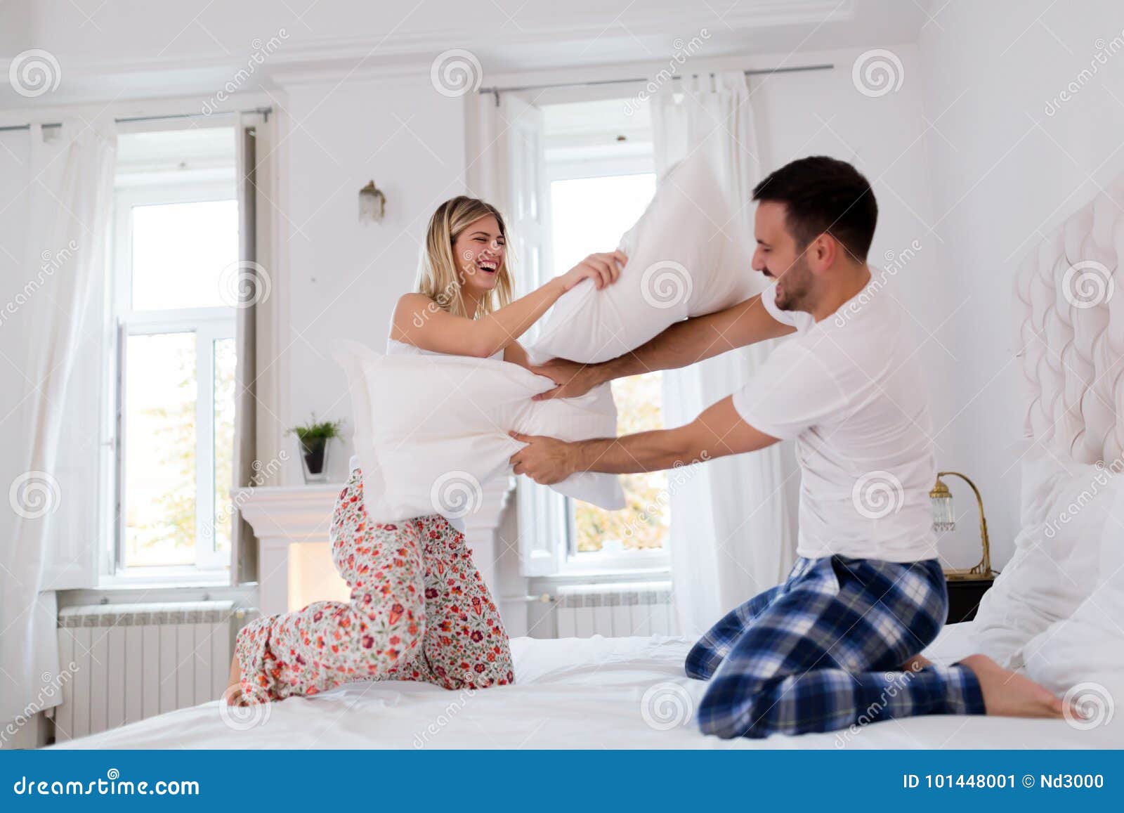 Happy Couple Fighting with Pillows in Bed Stock Image Image of
