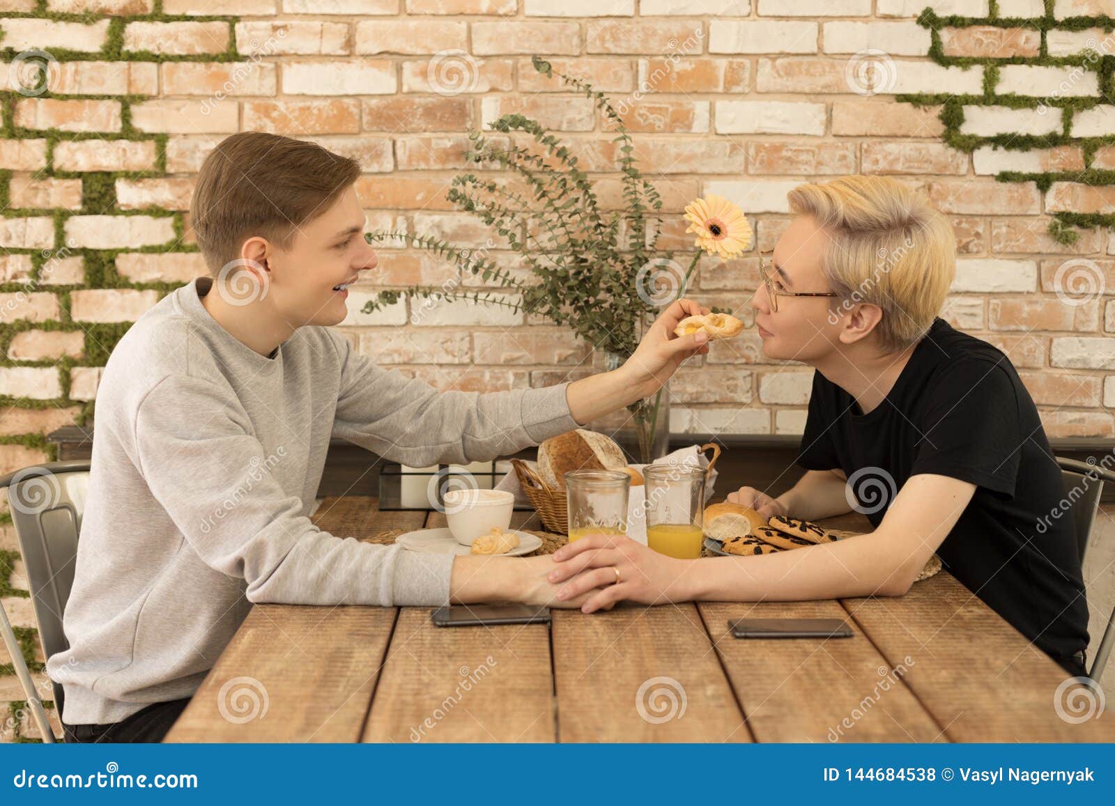 Happy Couple Have Breakfast At Home Kitchen Handsome