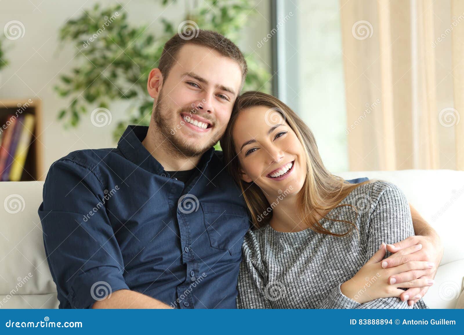 Happy Couple Poses In Front Of Their New Home Image & Design ID 0000199505  - SmileTemplates.com