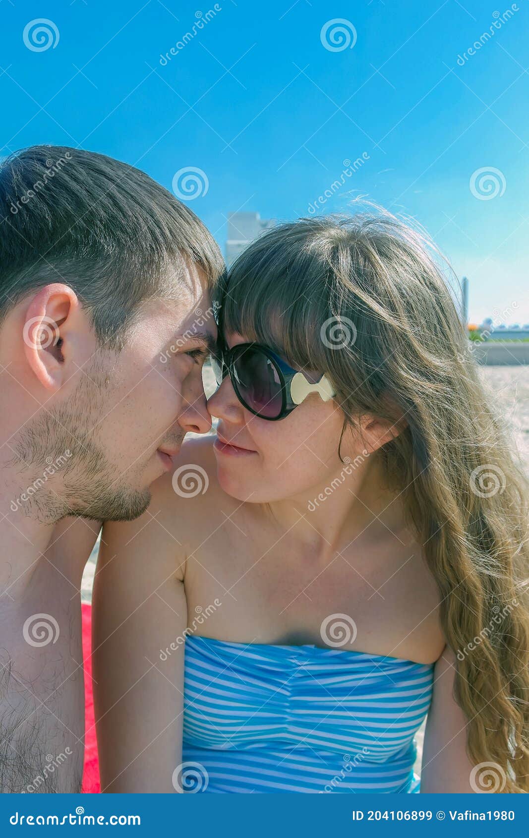 Happy Couple in Love Embracing Each Other, Looking with Love and Taking  Selfies. Young Man and Woman Sitting on Beach Enjoying Stock Image - Image  of holiday, love: 204106899