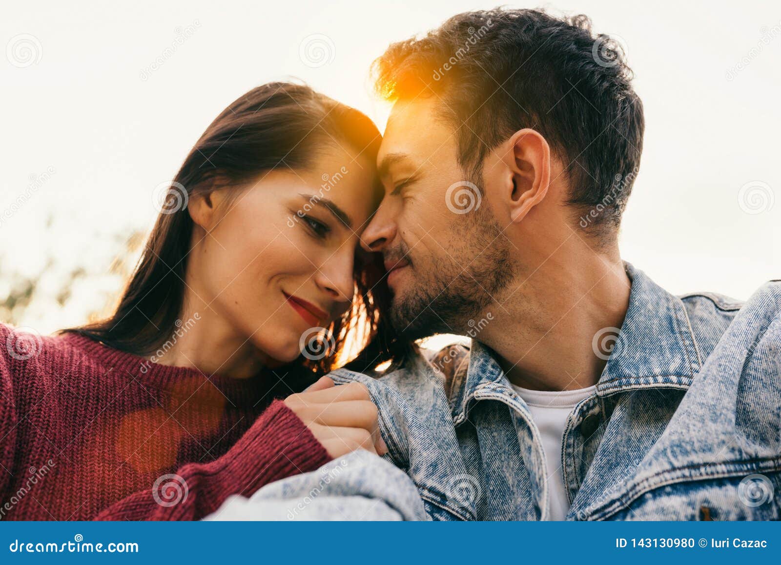 Happy Couple In Love Enjoying Sunshine Embracing Each Other Looking