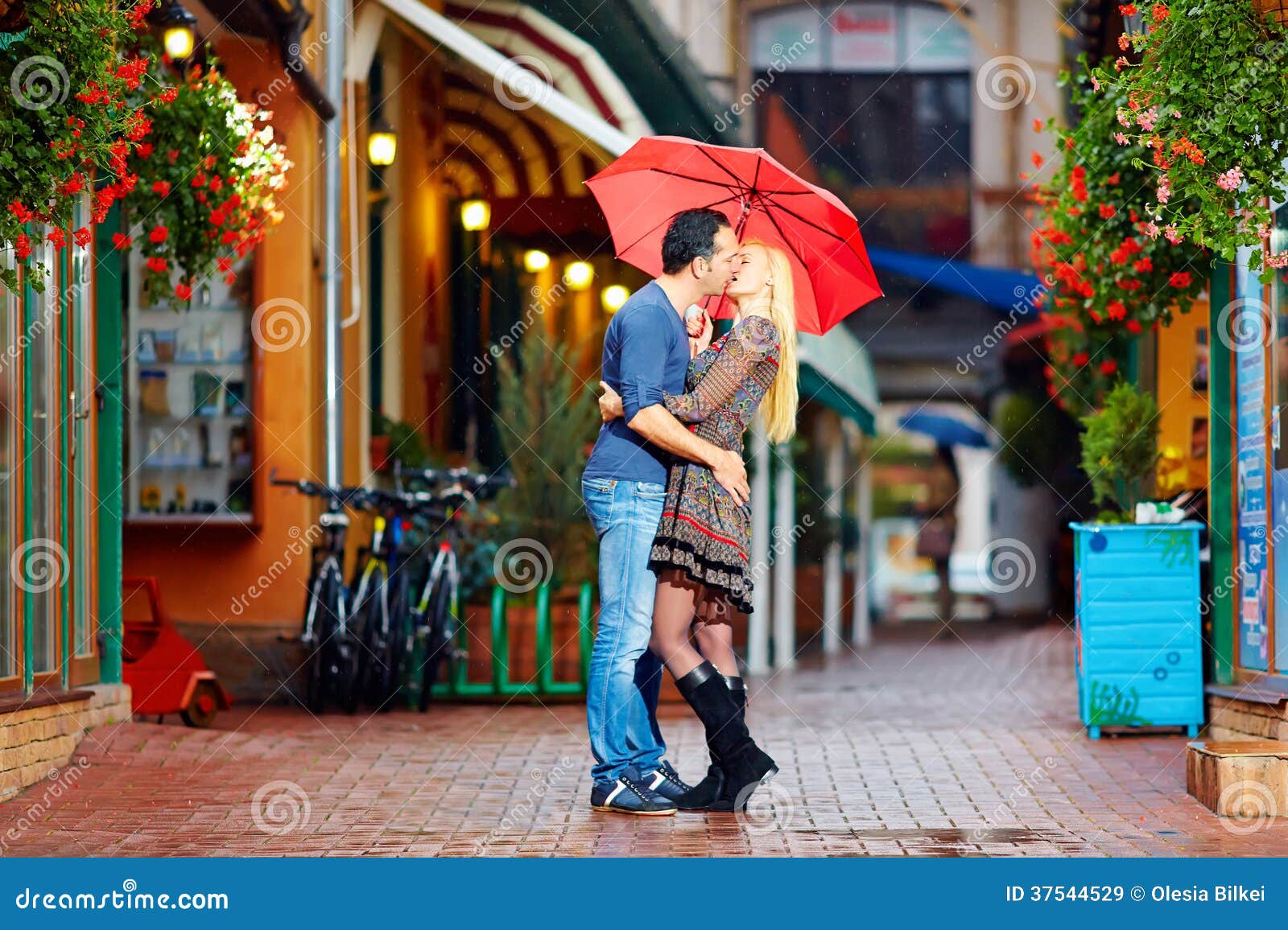 Happy Couple In Love Kissing On Rainy Street Royalty Free