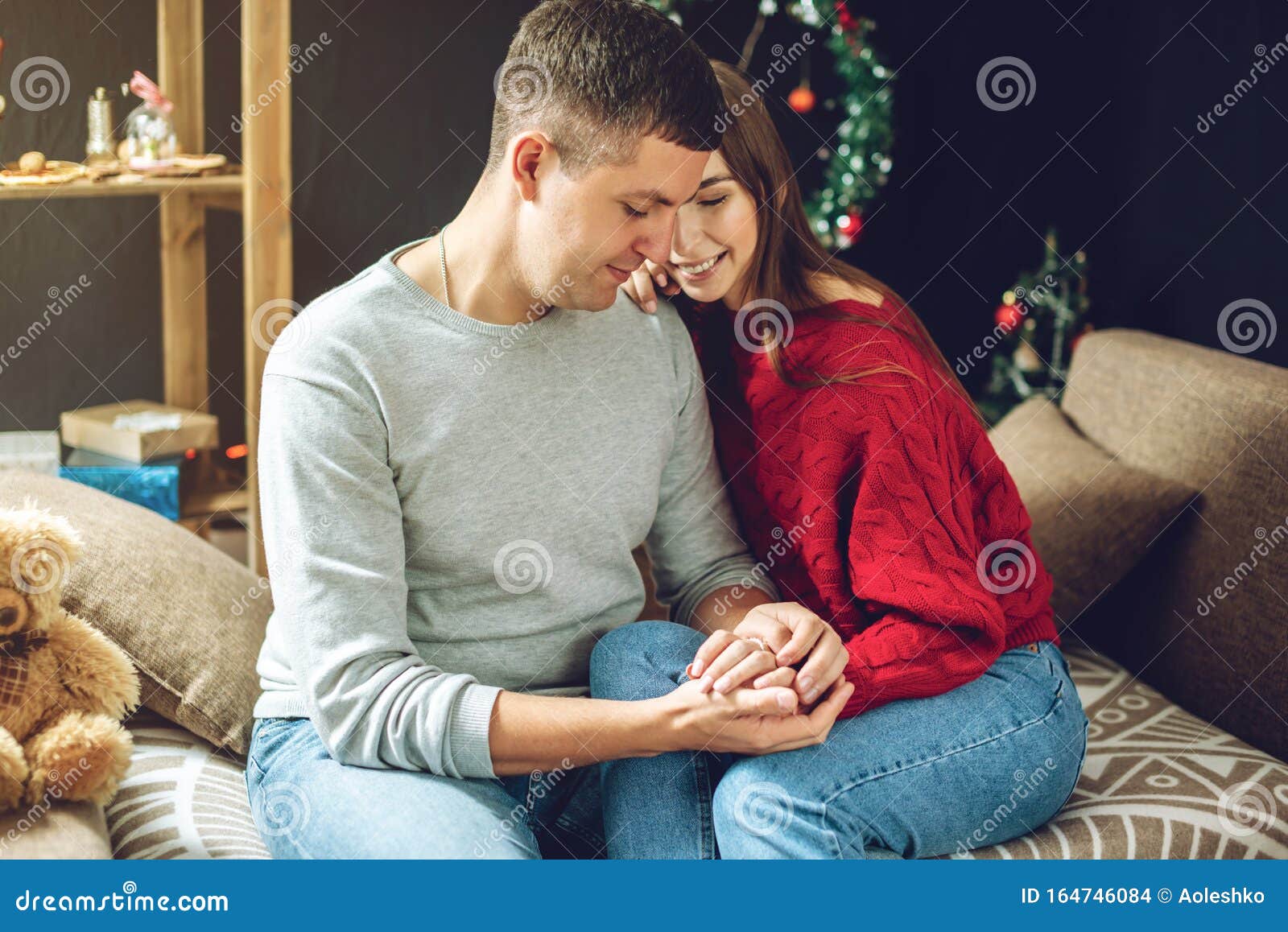 Couple Of Lovers Sit Hugging On The Sofa Holding Hands Romantic